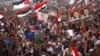 Supporters of Muslim Brotherhood's presidential candidate Mohamed Morsi celebrate his victory at Tahrir Square in Cairo, June 24, 2012. 