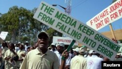 FILE - Journalists chant anti-government slogans and sing songs as they celebrate World Press Freedom Day.