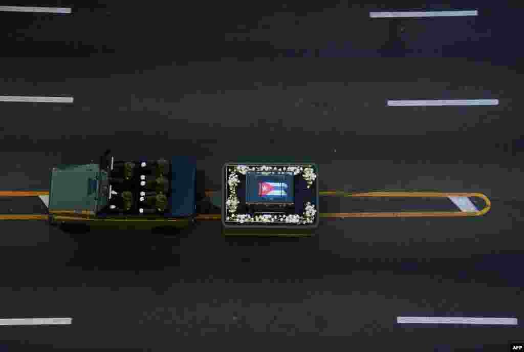 The urn with the ashes of Cuban leader Fidel Castro is driven through the streets of Havana starting a final four-day journey across Cuba, Nov. 30, 2016. 