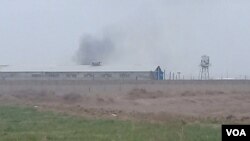 Smoke appears to rise from Qarchak women’s prison near Tehran, in this photo first published online by Iranian Dervish news outlet Majzooban Noor on Feb. 8, 2019.