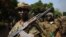 A picture taken on January 10, 2013 shows Seleka rebel coalition members take up positions in a village 12 kilometers from Damara.