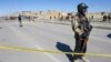 Security personnel inspect the site of a bomb blast in Quetta, Pakistan, on Feb. 1, 2024. On Feb. 2 in Mach, about 65 kilometers (40 miles) southeast of Quetta, government security forces killed 24 separatist militants in a counterinsurgency operation.