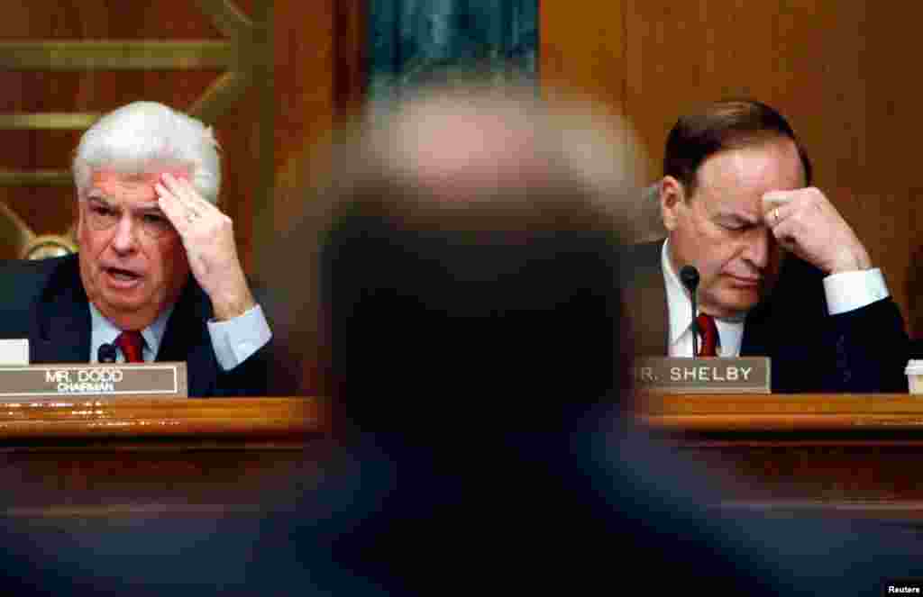 Christopher Dodd (L), chairman of the U.S. Senate Banking Committee and Sen. Richard Shelby (R-AL) listen to testimony from the leaders of the big Detroit automakers during hearing on a financial assistance package in Washington, December 2008.