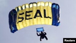 Samoyed dogs are judged during the first day of the Crufts dog show in Birmingham, central England.