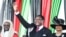 FILE - Malawi's newly elected President Lazarus Chakwera greets supporters after being sworn in in Lilongwe, Malawi, June 28 2020. 
