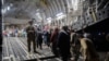 Afghans board a U.S. Air Force C-17 Globemaster III transport plane during an evacuation at Hamid Karzai International Airport, Afghanistan, August 22, 2021. (U.S. Air Force/Handout via Reuters)