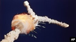 FILE - The space shuttle Challenger explodes shortly after lifting off from the Kennedy Space Center in Cape Canaveral, Florida, Jan 28, 1986.