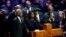 Flanked by the Rev. Al Sharpton and her husband, Rodney Wells, RowVaughn Wells speaks during the funeral service for her son Tyre Nichols at Mississippi Boulevard Christian Church in Memphis, Tenn., Feb. 1, 2023. 