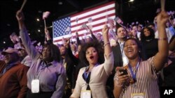 Supporters of President Barack Obama react to favorable media projections at the McCormick Place during an election night watch party in Chicago, Tuesday, Nov. 6, 2012.