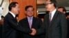 Cambodian Prime Minister Hun Sen, left, shakes hands with opposition party leader Sam Rainsy, right, after a meeting, as Sar Kheng, center, deputy prime minister, looks on at the National Assembly in Phnom Penh, Cambodia, Monday, Sept. 16, 2013. Hun Sen and Sam Rainsy met for the second time on Monday in a bid to resolve a political stalemate, a day after violent clashes on the streets of Phnom Penh. (AP Photo/Heng Sinith)Cambodia Election
