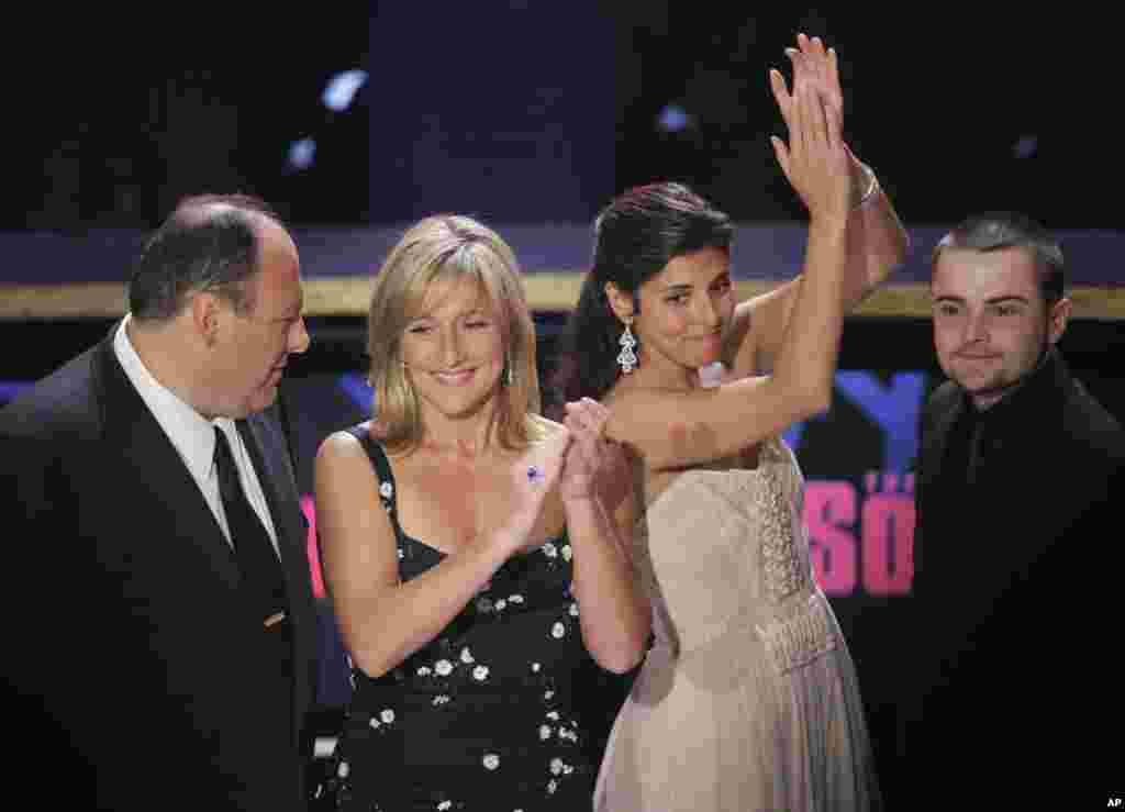 Cast members from "The Sopranos" from left, James Gandolfini, Edie Falco, Jamie-Lynn Sigler and Robert Iler applaud at the 59th Primetime Emmy Awards, Sept. 16, 2007.