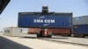FILE - Containers are unloaded from a railway rack at the Inland Container Depot at Sachana village, India, April 21, 2017. India has announced it will not sign on to the Regional Comprehensive Economic Partnership, a major regional trade pact.