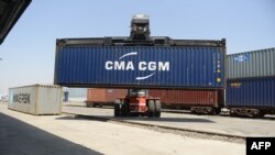 FILE - Containers are unloaded from a railway rack at the Inland Container Depot at Sachana village, India, April 21, 2017. India has announced it will not sign on to the Regional Comprehensive Economic Partnership, a major regional trade pact.