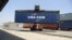 FILE - Containers are unloaded from a railway rack at the Inland Container Depot at Sachana village, India, April 21, 2017. India has announced it will not sign on to the Regional Comprehensive Economic Partnership, a major regional trade pact.