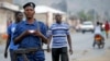 FILE - Burundi police patrol the streets of Musaga district in the capital Bujumbura after the results of the presidential elections were released, July 24, 2015.