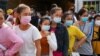Garment factory workers and staff wait to receive China's Sinovac coronavirus disease (COVID-19) vaccine at an industrial park in Phnom Penh, Cambodia, April 7, 2021. REUTERS/Cindy Liu