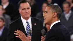 U.S. President Barack Obama (R) speaks as Republican presidential nominee Mitt Romney (L) listens during the second U.S. presidential debate in Hempstead, New York, October 16, 2012. 