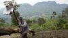 Muneman Rugema, 22, works on a field near in Masisi, 88 km (55 miles) northwest of Goma, DRC, Dec. 19, 2008.