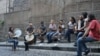 Members of musical group Kardeş Türküler rehearse a song outside their studio in Istanbul, Turkey. (Osseily Hanna)