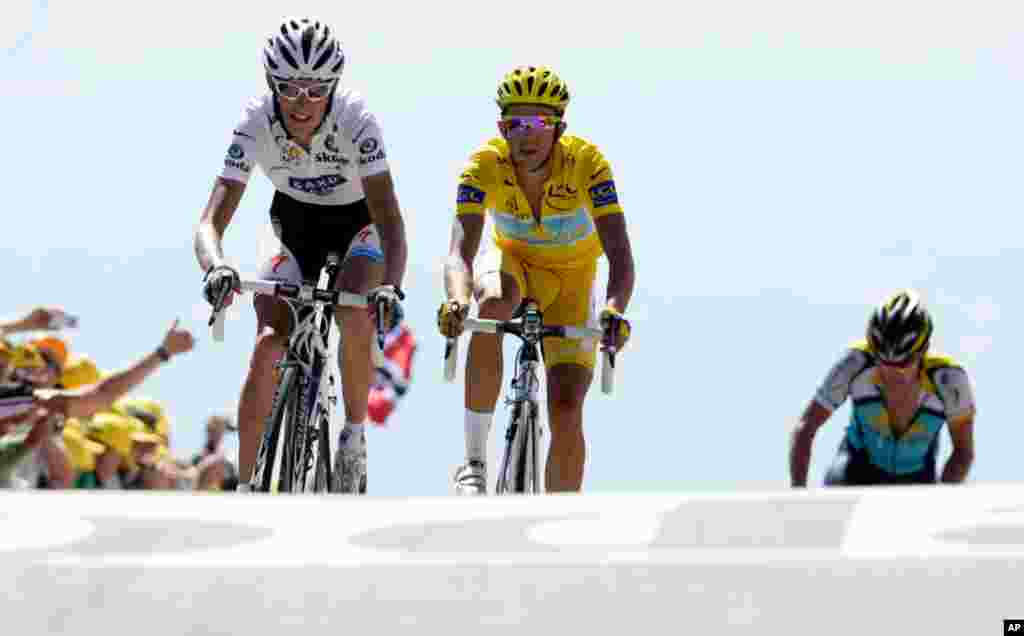 July 25, 2009: Andy Schleck of Luxembourg, Alberto Contador of Spain, and Lance Armstrong, left to right, cross the finish line during the 20th stage of the Tour de France.