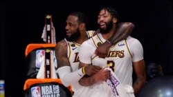 Los Angeles Lakers' LeBron James (23) and Anthony Davis (3) celebrate after the Lakers defeated the Miami Heat 103-88 in Game 6 of basketball's NBA Finals Sunday, Oct. 11, 2020, in Lake Buena Vista, Fla. (AP Photo/Mark J. Terrill)