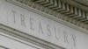 FILE - This May 4, 2021 file photo shows the Treasury Building in Washington. Nearly a year after the U.S. Treasury Department said it supports a global minimum corporate tax rate of at least 15%, Congress has been unable to pass legislation to implement it.