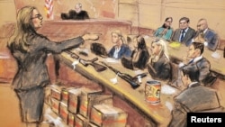 Assistant U.S. Attorney Andrea Goldbarg points at Mexican drug lord Joaquin "El Chapo" Guzman, back row center, in this courtroom sketch during Guzman's trial in Brooklyn federal court in New York City, Jan. 30, 2019. 
