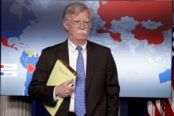 FILE - National Security Adviser John Bolton listens during a press briefing at the White House, Jan. 28, 2019, in Washington.