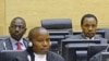Kenyan suspects (back row), William Ruto (L) and Henry Kosgey (R), accused of crimes against humanity in their country's post-election violence in 2007-08, make their initial appearance at the International Criminal Court in The Hague, April 7, 2011