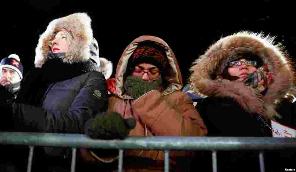 A woman cries during the one-year anniversary vigil for the victims of the fatal shooting at the Centre Culturel Islamique de Quebec in Quebec City, Canada, Jan. 29, 2018.