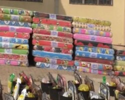 Mattresses and basic needs are handed to Chinese workers fleeing from CAR, Garoua Boulay, Cameroon, Jan. 10, 2021. (Moki Edwin Kindzeka/VOA)