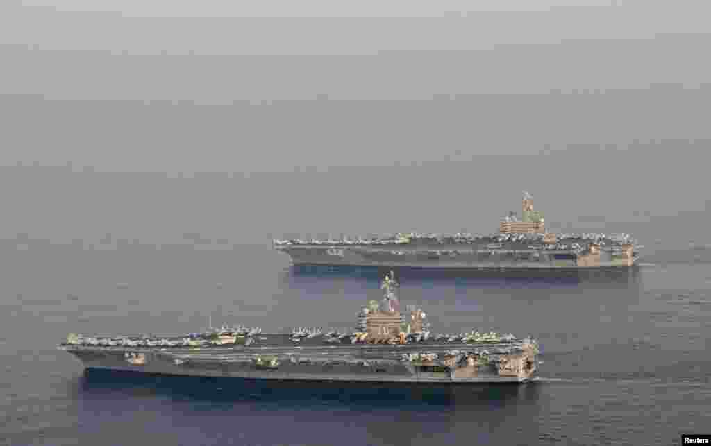 2014年10月18日，美国航空母舰卡尔文森号和布什号换防。布什号以老布什命名。