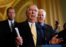 FILE - Senate Republican leader Mitch McConnell speaks to reporters in the Capitol in Washington, Sept. 16, 2014.