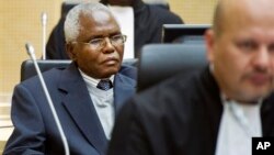 Cabinet Secretary Francis Muthaura, left, in the courtroom of the International Criminal Court, The Hague, Netherlands, Sept. 21, 2011.