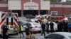 Emergency personnel gather outside the Carmike Hickory 8 movie theater following a shooting in Antioch, near Nashville, Tennessee, August 5, 2015.