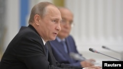 Russian President Vladimir Putin speaks during a meeting of the Lomonosov Moscow State University Supervisory Board at the Kremlin in Moscow, Russia, May 28, 2015.