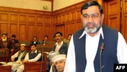 Ikramullah Khan Shahid (R), deputy speaker of a religious parties alliance Muttahida Majlis-e-Amal, pictured in Peshawar, Pakistan, January 1, 2003.