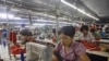 Myanmar laborers work in a garment factory on the outskirts of Yangon.