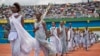 Performers re-enact some of the events enter a public ceremony to mark the 20th anniversary of the Rwandan genocide, at Amahoro stadium in Kigali, Rwanda, April 7, 2014.