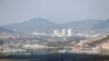 FILE PHOTO: Kaesong city is seen behind the inter-Korean Kaesong Industrial Complex, across the DMZ separating North Korea from South Korea in this picture taken from Dora observatory in Paju