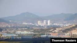 FILE PHOTO: Kaesong city is seen behind the inter-Korean Kaesong Industrial Complex, across the DMZ separating North Korea from South Korea in this picture taken from Dora observatory in Paju