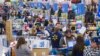 Customers wrap up their holiday shopping during Walmart's Black Friday events in Bentonville, Ark., Thursday, Nov. 27, 2014.