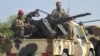FILE - A convoy of Cameroon's army soldiers as part of a reinforcement of its military forces against Nigerian Islamist group Boko Haram.