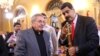 FILE - Venezuela's President Nicolas Maduro, right, shows a sword of Venezuelan national hero Simon Bolivar to Cuba's President Raul Castro in Caracas, Venezuela, March 5, 2017. 