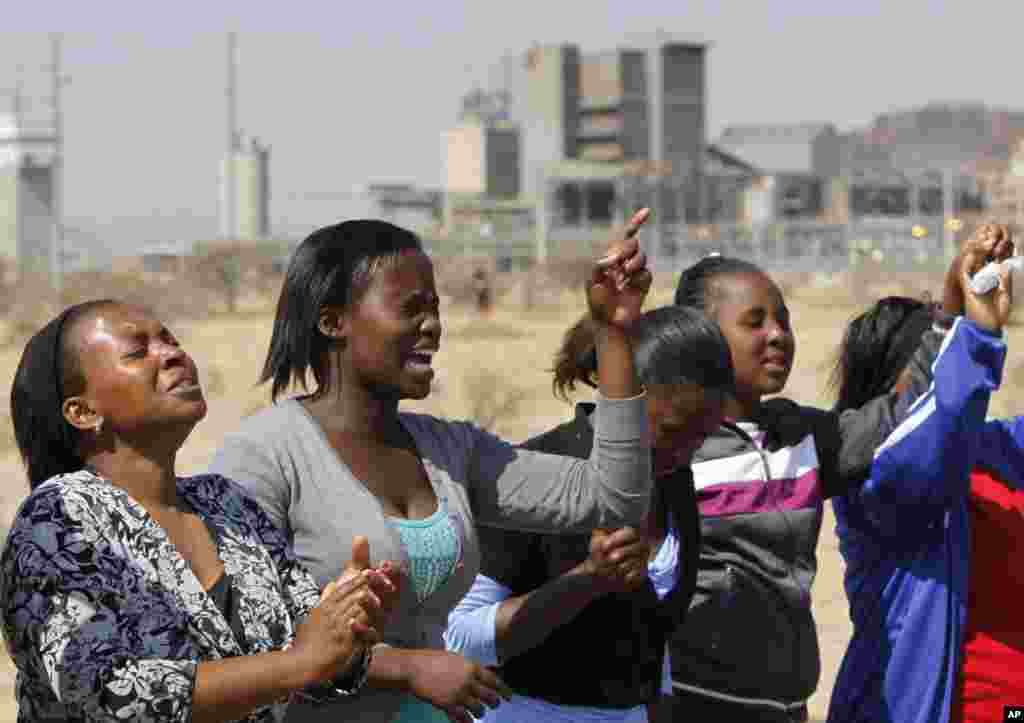 Women from a group of churchgoers at the Lonmin platinum mine during a memorial service for 34 dead striking miners who were shot and killed, Aug. 19, 2012.