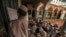 FILE - Pakistani religious students attend a lesson at Darul Uloom Haqqania, an Islamic seminary and alma mater of several Taliban leaders, in Akora Khattak, Khyber Pakhtunkhwa province.