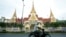 A man rides his motorbike in front of the National Assembly complex on May 02, 2018. (Aun Chhengpor/VOA Khmer)