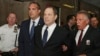 Harvey Weinstein is escorted in handcuffs to a courtroom in New York, Monday, July 9, 2018. 