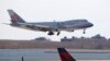 FILE - A China Airlines cargo jet lands at John F. Kennedy International Airport, March 14, 2020, in New York. 