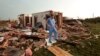  Nathan Ulepich searches outside the back of his house destroyed after a powerful tornado ripped through the area on May 20, 2013 in Moore, Oklahoma. 